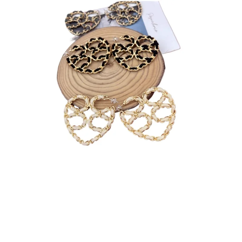 

Hollow woven love earrings rope woven peach heart large exaggerated earrings retro tide