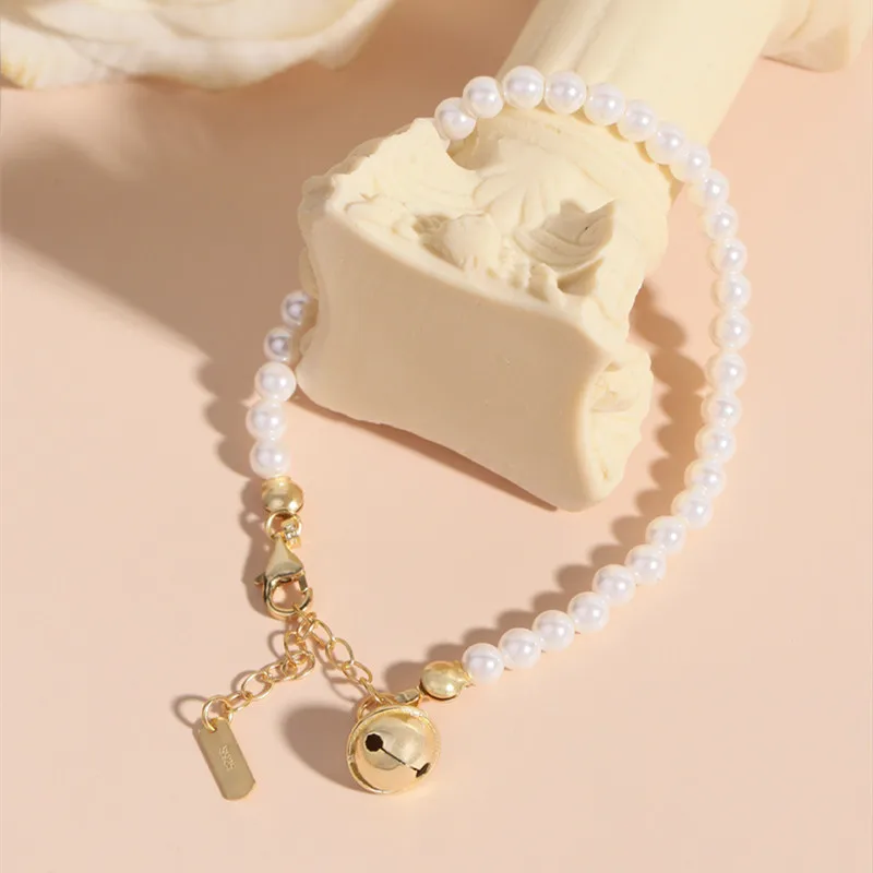 

Женский браслет из стерлингового серебра S925, позолоченный колокольчик, жемчужная подвеска, популярные модные украшения, аксессуары для вечеринок.