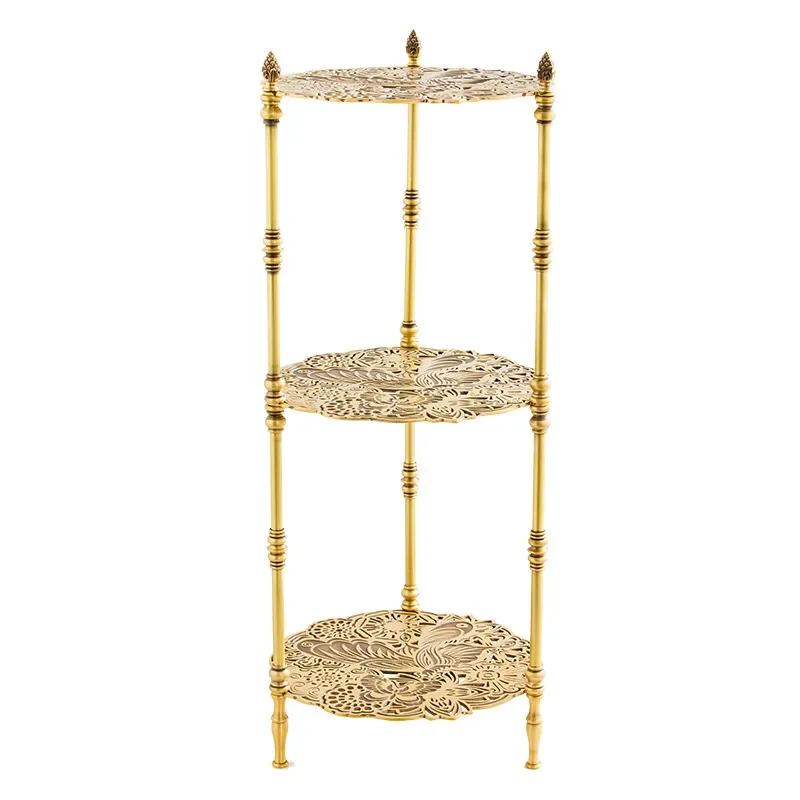 

Vintage brass carved objects, living room side table, medieval flower stand