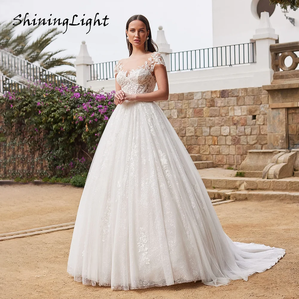 

ShiningLight Ball Gown Wedding Dresses Cap Sleeve Backless Lace Appliques Tulle Bride Gowns Vestidos De Novia Robe Customized