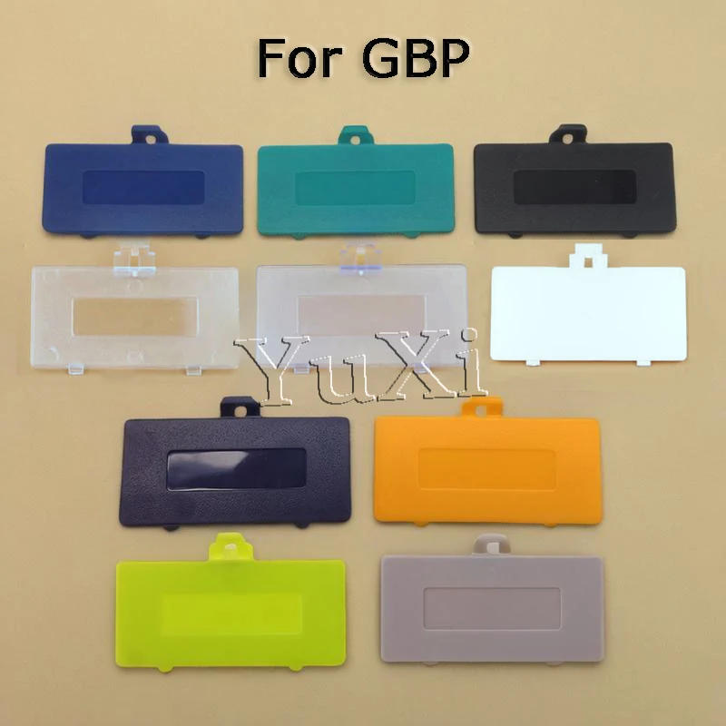 YuXi 10 สี 1PC สําหรับ GameBoy Pocket GBP คอนโซลแบตเตอรี่ประตูเปลี่ยนฝาปิดฝาหลังแบตเตอรี่ประตูอะไหล่ซ่อม