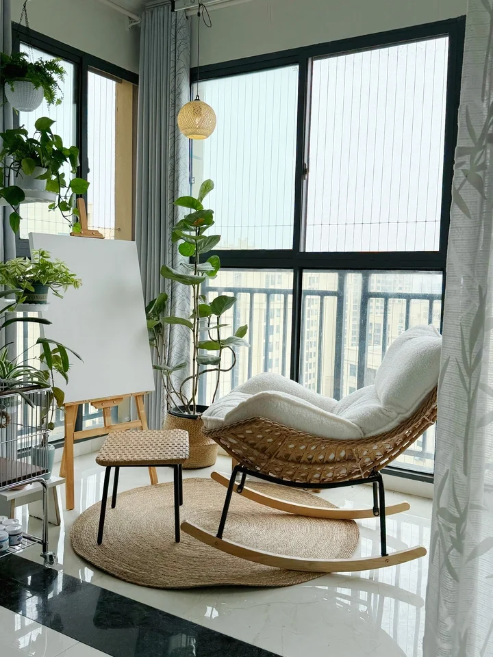 Natural wicker rocking recliner with wood frame in a living room corner