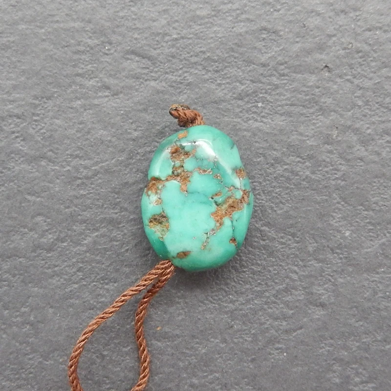 

Natural Turquoise Irregular-Shaped Pendant with Rust Inclusions, Handmade Jewelry, Artisanal Crafts 16x11x6mm-1.6g