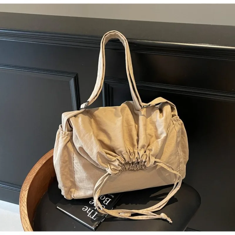 

Nylon shoulder bag drawstring opening design with adjustable shoulder strap casual lightweight oblique span bag