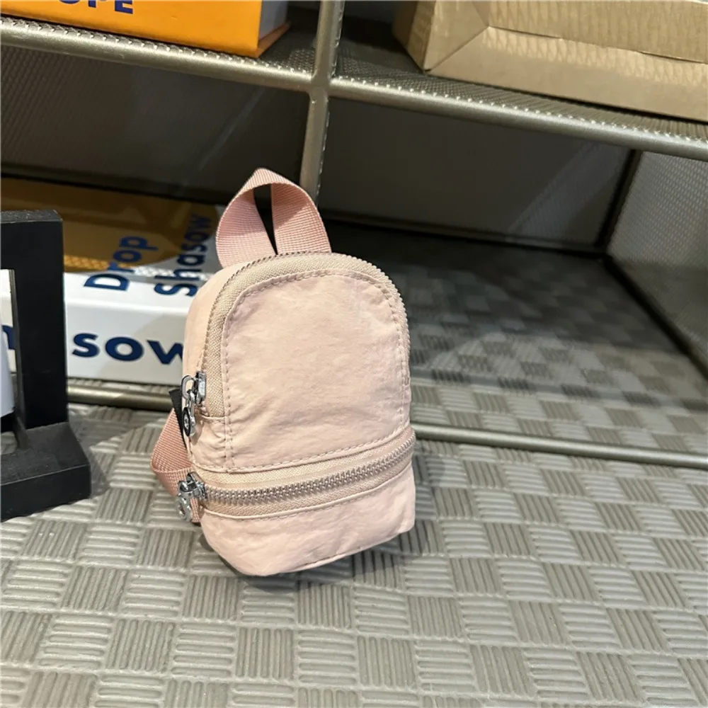 Simpatica mini zaino in nylon tinta unita, mini borsa a tracolla, portafoglio piccolo, borsa da appendere in stile coreano