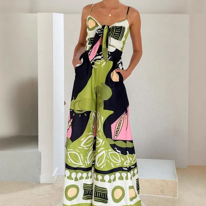 

Fashion High Street Printed Women Jumpsuit 2025 New Summer Hollow Tie Up Beach Romper Casual Sleeveless Pocket Wide Leg Playsuit