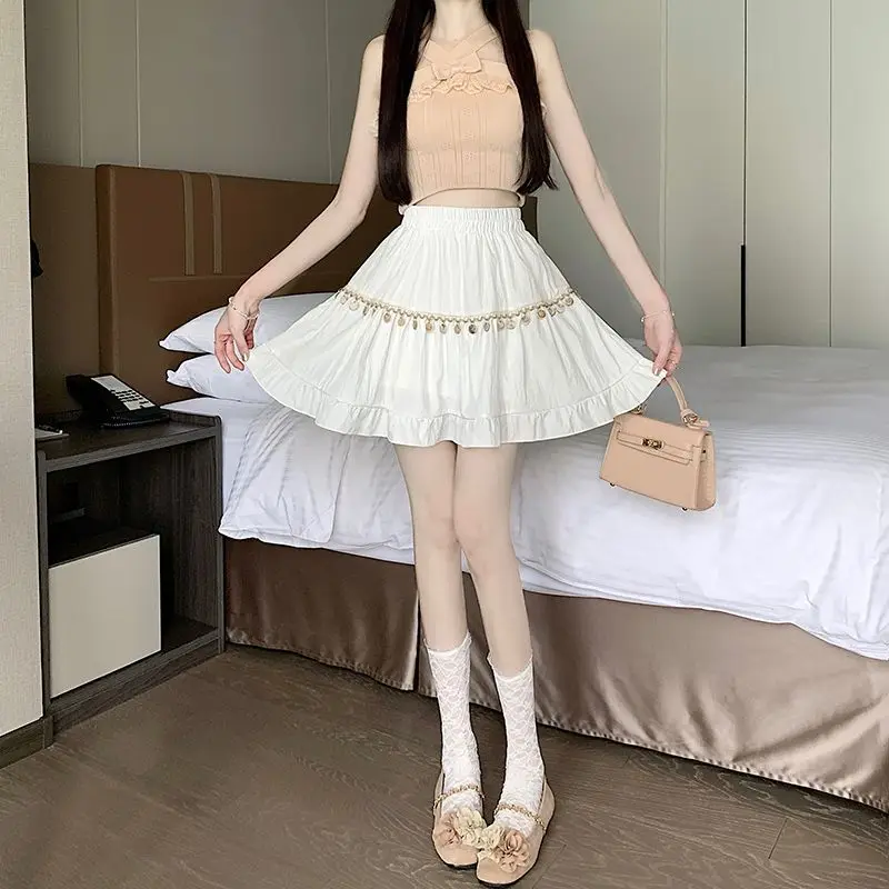 Zoete effen kleur gesplitste ruches kwastje rokken vrouwelijke kleding 2025, zomer nieuwe losse elastische hoge taille preppy stijl rokken