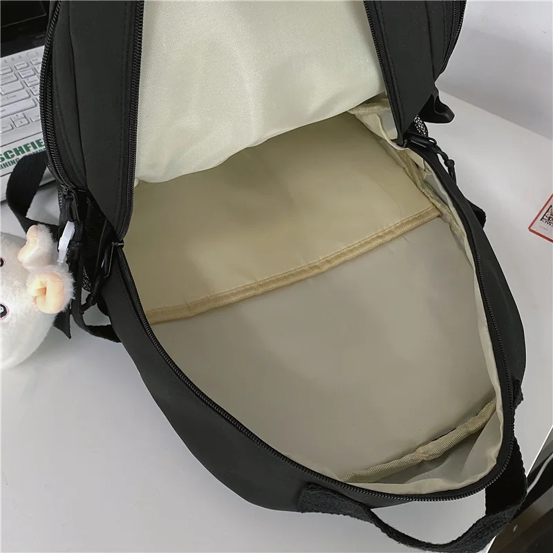 Mochila escolar impermeable para adolescentes, morral de viaje de nailon, de alta capacidad, color negro, a la moda, para hombre y mujer