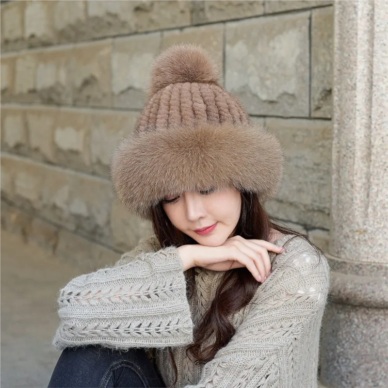 A new style of woolen knitted fur hat for women paired with pom-pom and ear-protecting leather