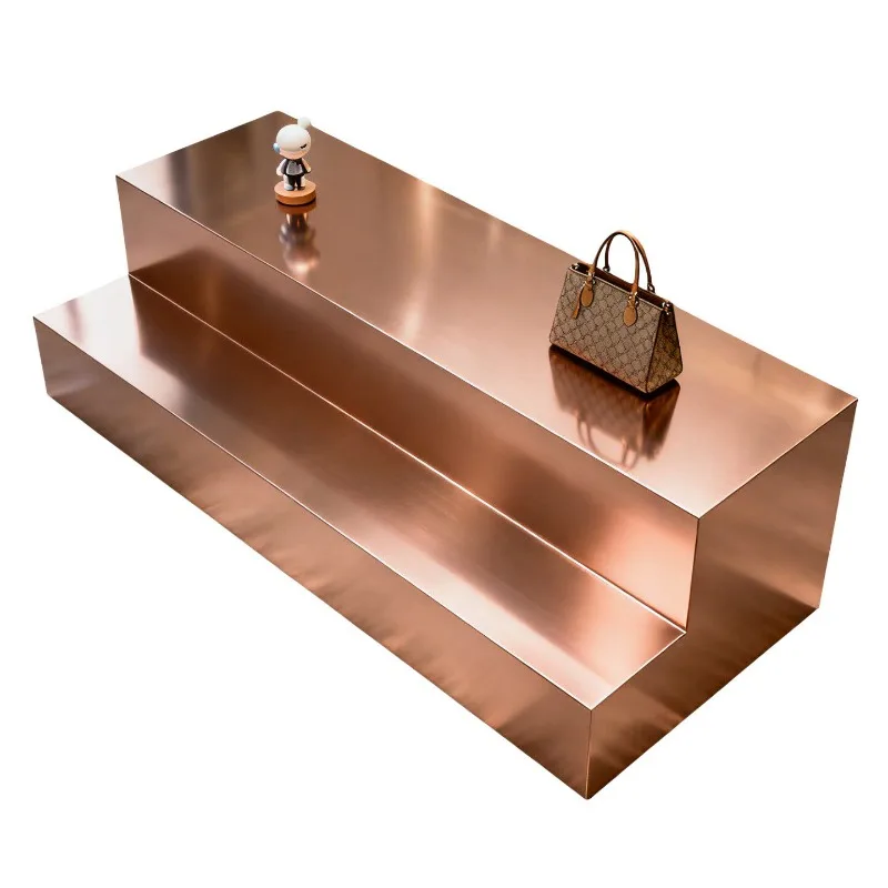 In the middle of the stainless steel display table, there is a shoe bag display table