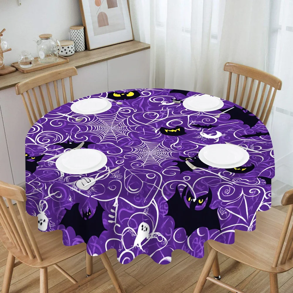 One Halloween-themed tablecloth, featuring a pattern of spooky spider webs and bats.zyc