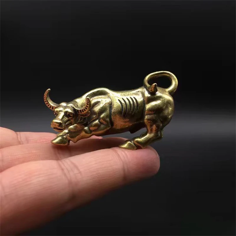 

Solid brass powerful bull small ornament, with a soaring bull aura, auspicious zodiac sign, and a wealth attracting small orname