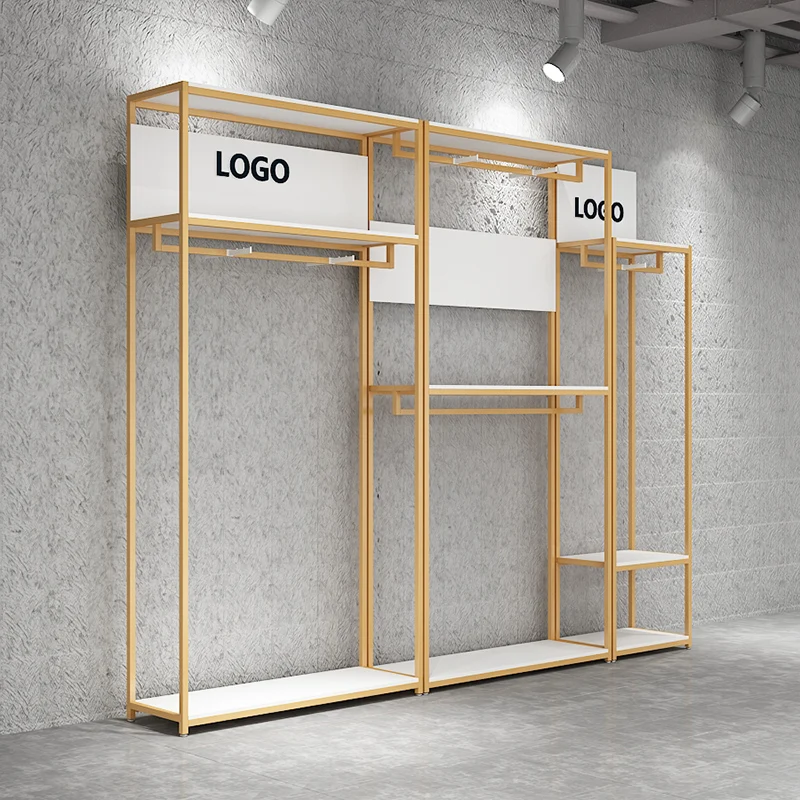 

Индивидуальные золотые витрины для одежды, декорации для магазинов модных аксессуаров, популярные украшения для розничных бутиков.