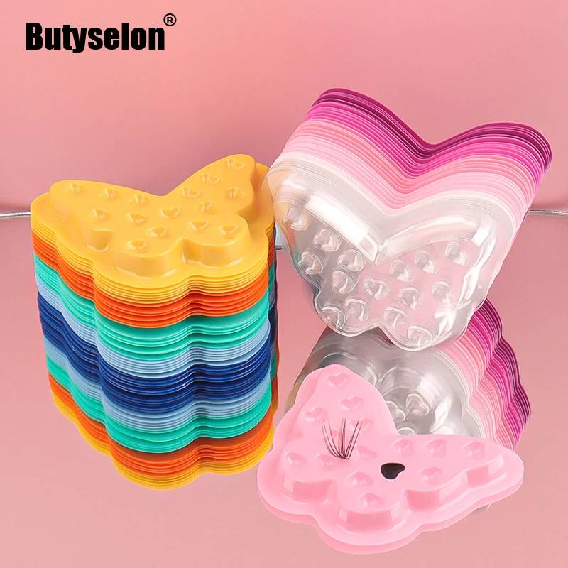 

100pcs Butterfly Shape False Lash Glue Holder Pad Gasket Eyelash Extension Plastic Pallet Adhesive Tray Tattoo Pigment Tools