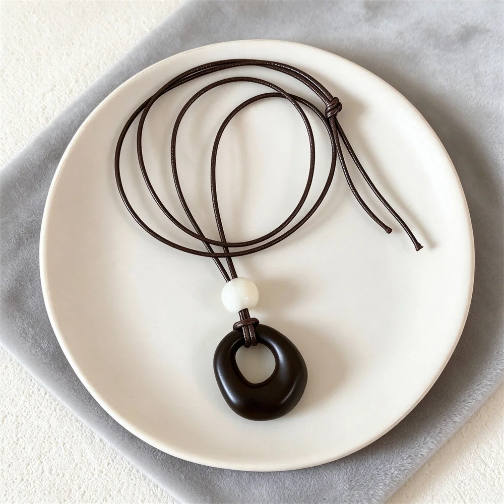 Irregular Hollow Circular Resin Pendant Necklace Adjustable Length Wooden Circular Geometric Pendant Necklace Leather Rope
