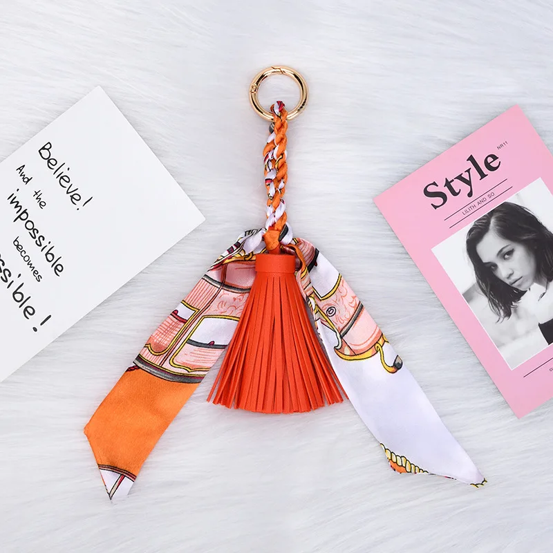 Premium Leather Keychain with Elegant Ribbon Bow and Tassel Design for Handbags Purses Cars and Scarves Ideal Christmas Gift for