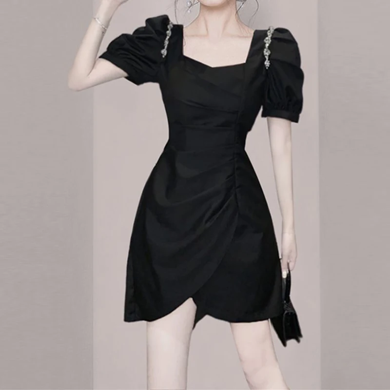 New French dress  summer  2023, with a slim design and a slim waist, small square neck, small black dress