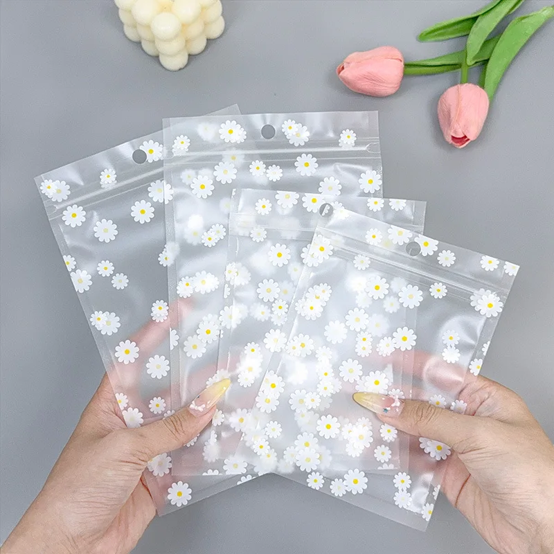 

300PCS Resealable Ziplock Bags with Daisy Design - Clear Plastic Bags with Hang Holes it for Retail, Snacks, Tea, Candy & Crafts