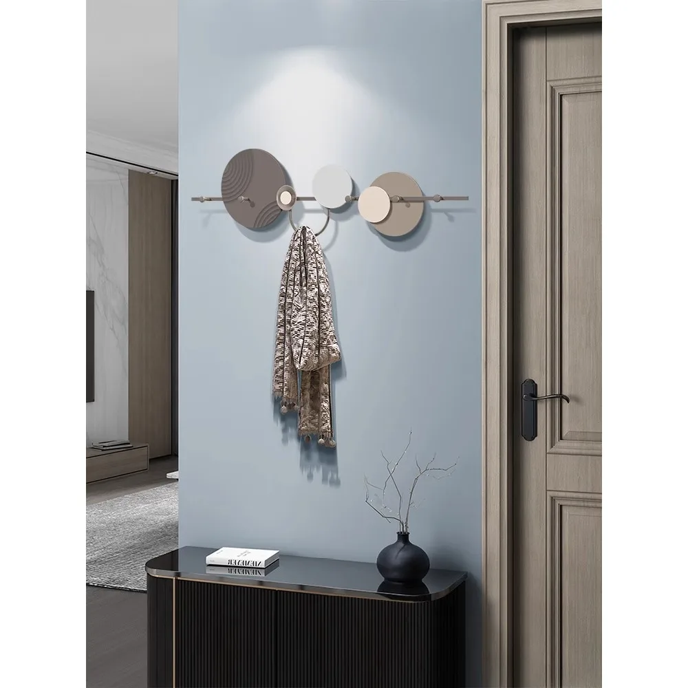 Creative clothes hooks at he entrance foyer, door keys, clothes hangers on the wall, and wall hangers at te back of t door c