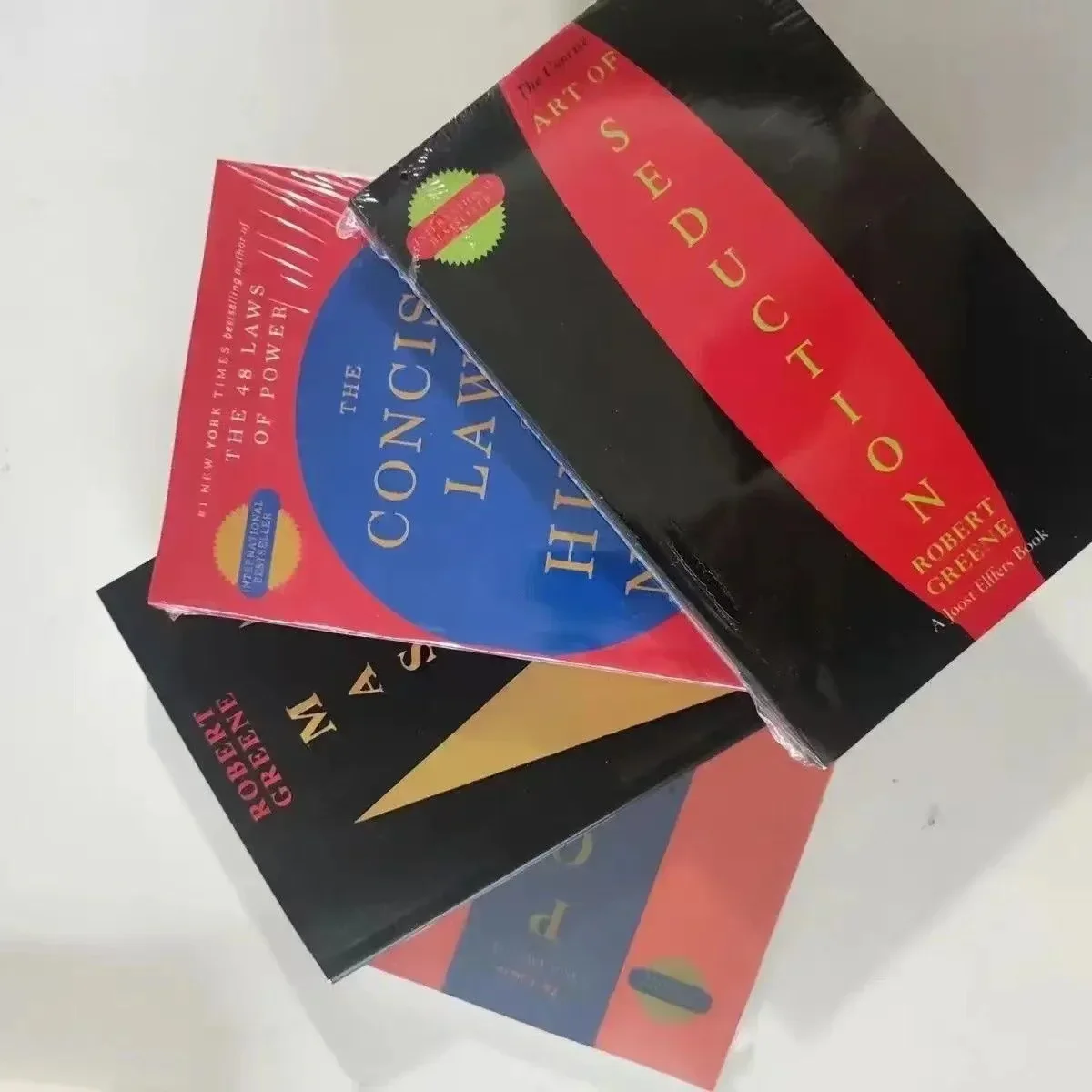 

4 Books Set By Robert Greene The Concise 48 Laws of Power; The Concise Laws of Human Nature; The Art of Seduction & Mastery