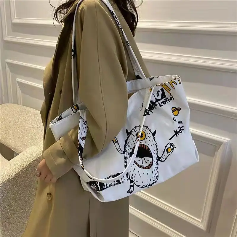 Bolsos de mano versátiles de gran capacidad para mujer, bolsos de hombro que combinan con todo, monstruo de Halloween, dibujos animados, estudiantes, otoño e invierno, 2021