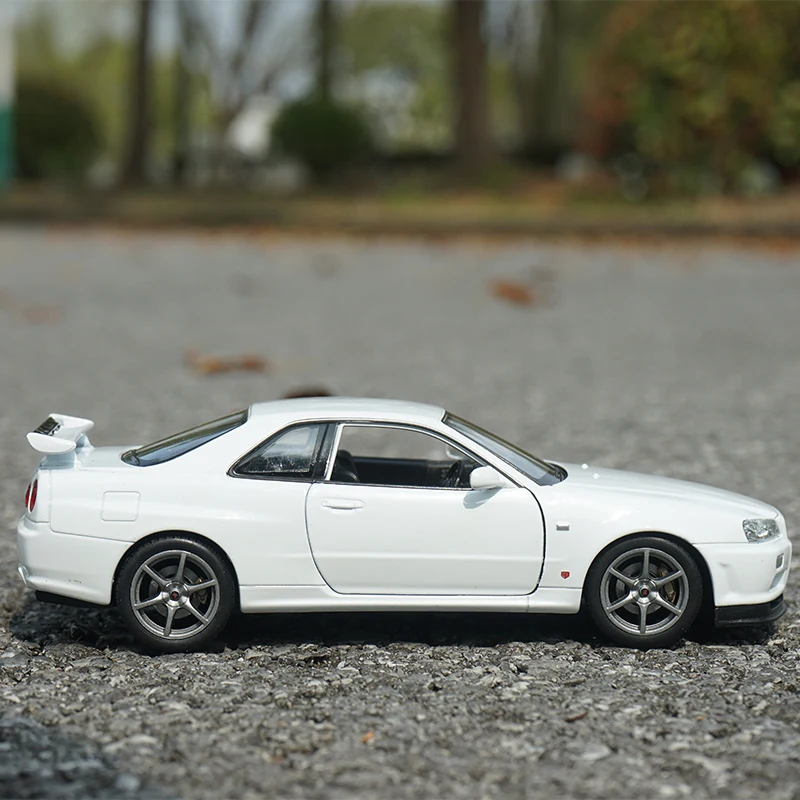 Welly-coche deportivo de aleación modelo Nissan Skyline GTR R34, juguete de Metal fundido a presión, colección de modelos de coches de carreras,