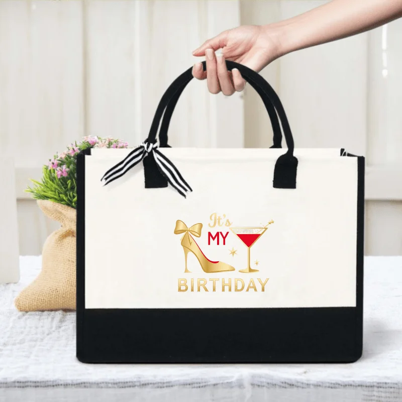 Cream and black handbag, high heels and cocktail glass with 