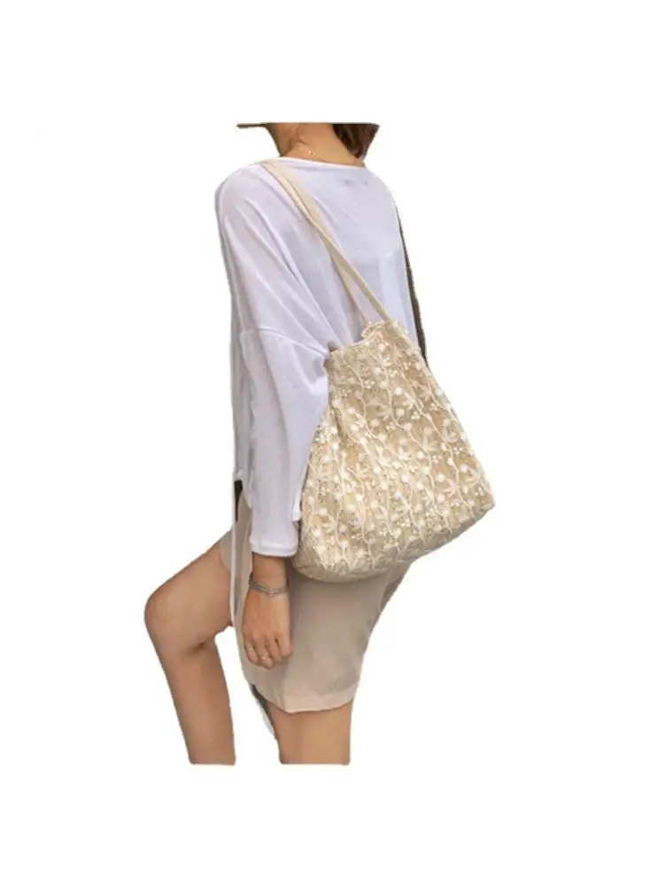 Fairy handbag 2023 han edition of the new fashion lace shoulder bag woven bucket bag joker straw bag