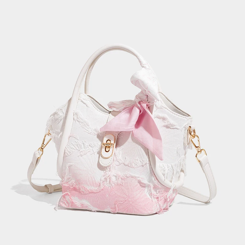 Women's handbag crossbody bagNiche Original Gradient Pink Tassel Bow Bucket BagFemale2026New Commuting Handbag Tote Bag