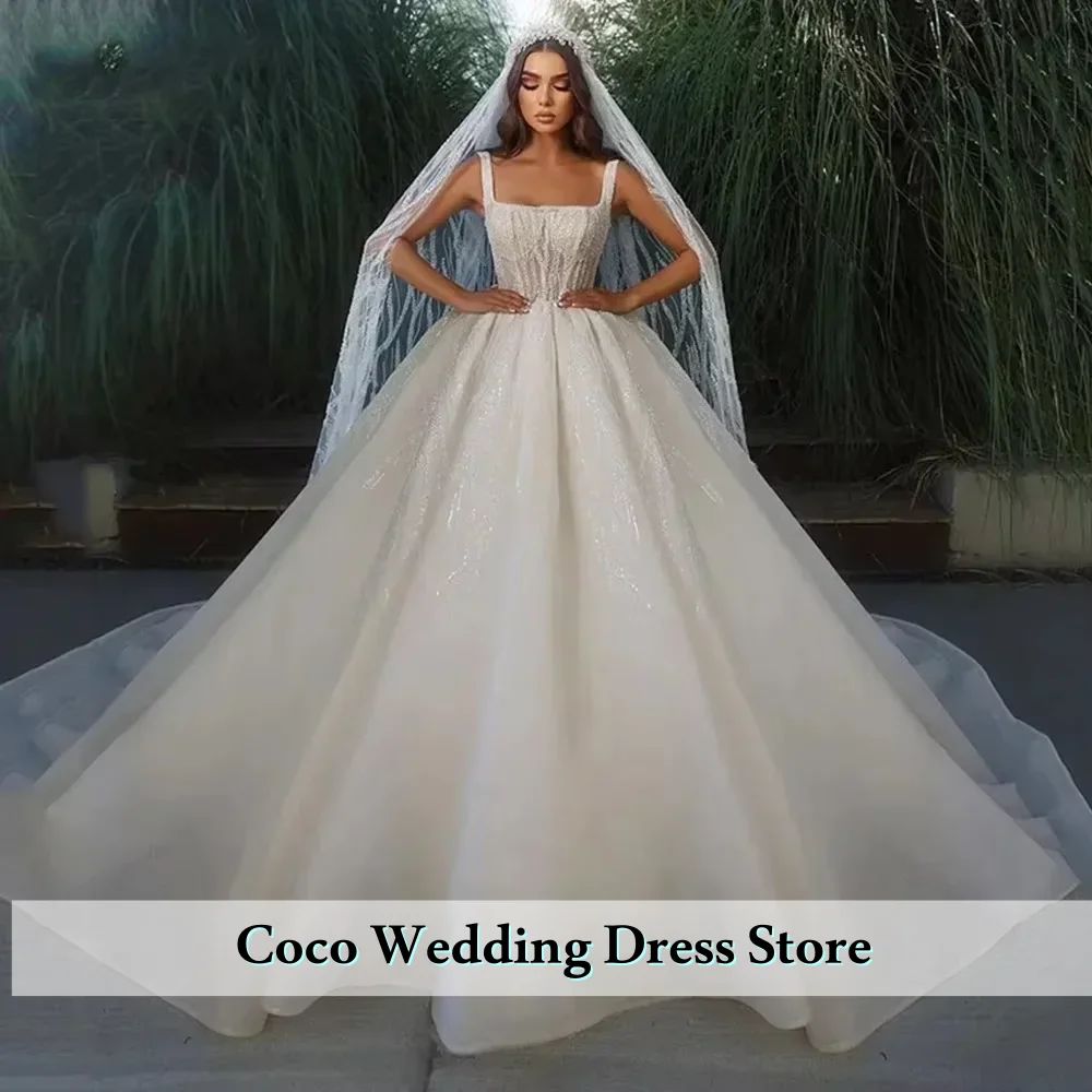 カスタマイズされた絶妙なノースリーブボールガウンウェディングドレススクエアカラービーズ付きプリンセスブライドプラスサイズウェディングドレス