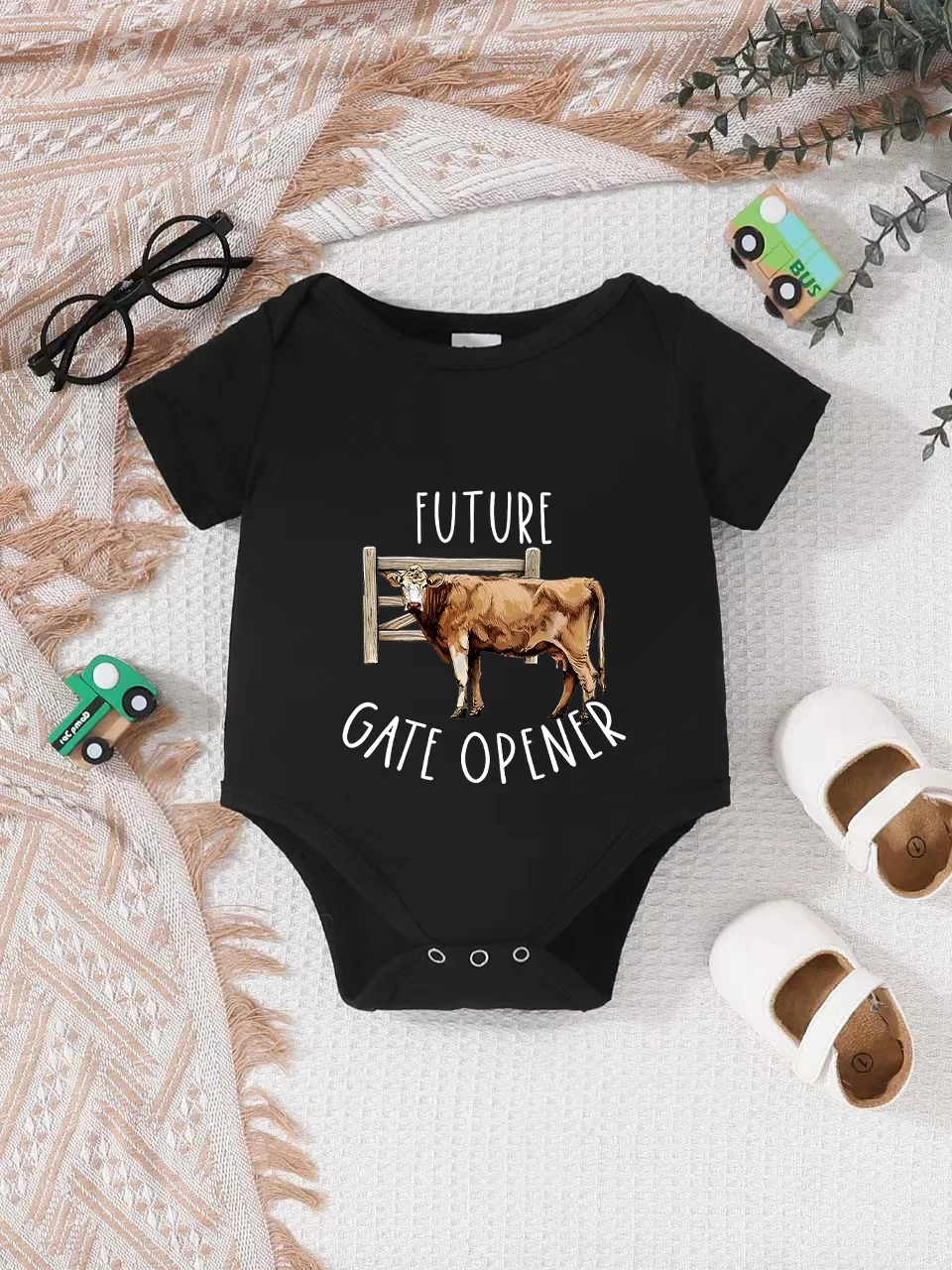 Playful letter-printed baby short-sleeve triangle bodysuit. Button closure for easy dressing