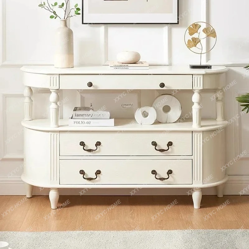 A  American retro solid wood semicircular entrance table is facing the door, and the entrance table is against the wall c