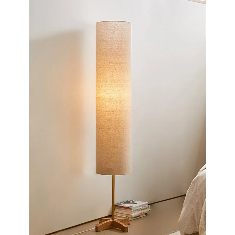 Living room, bedroom, homestay, creative solid wood vertical floor lamp next to the sofa c