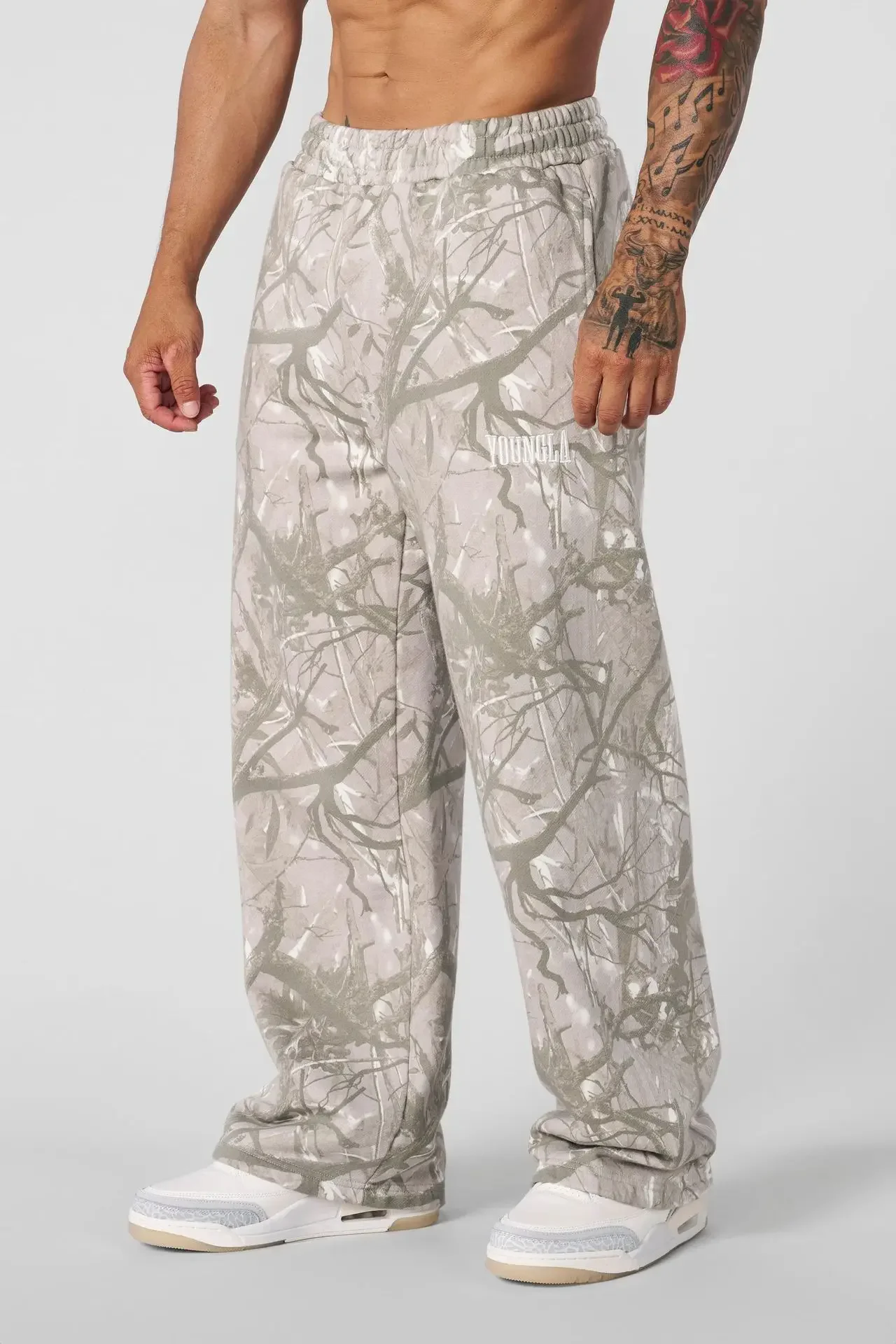 2025 Pantalones deportivos de pierna recta con estampado de camuflaje digital de marca de moda americana, pantalones de pierna ancha sueltos y versátiles