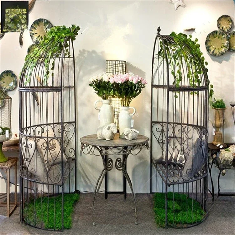 European style iron semi-circular bird cage with floor to ceiling seats, balcony, outdoor restaurant