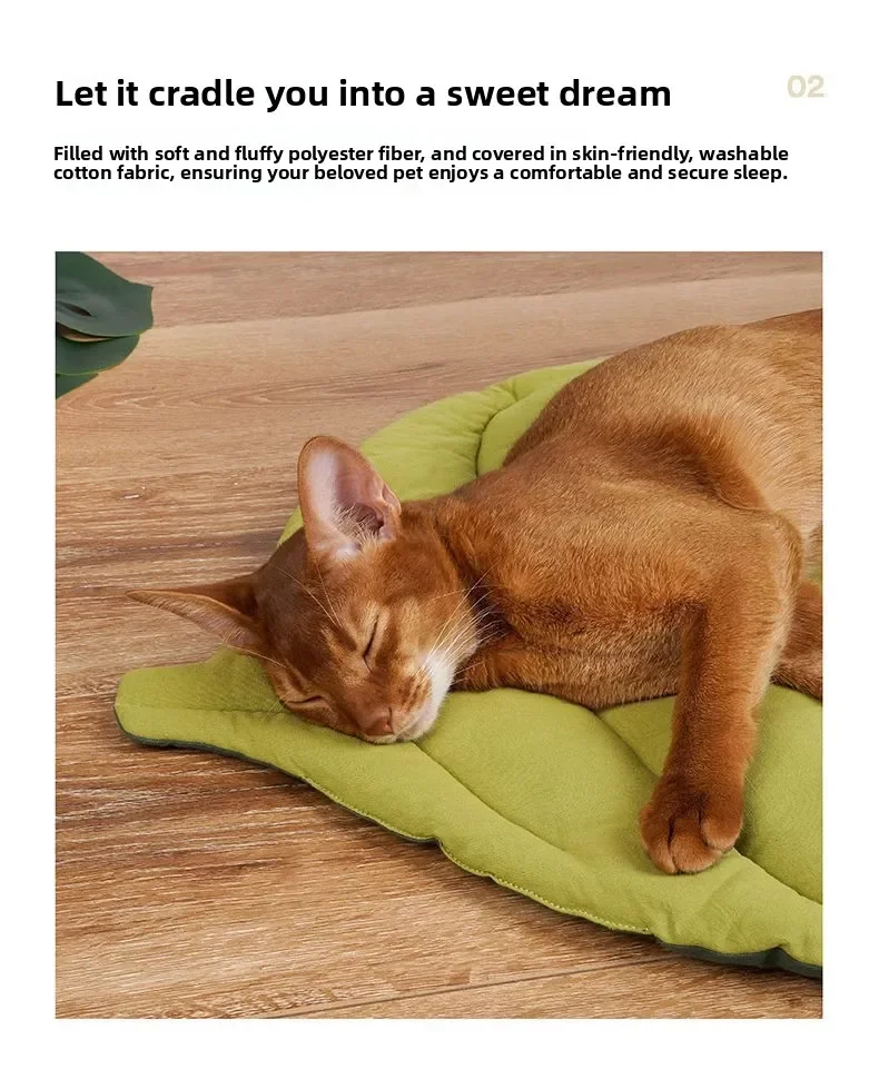 A cat sleeping on a Leaf Pattern Cat Sleeping Mat, which is a leaf-shaped green reversible pet mat.