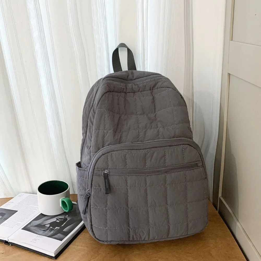 حقيبة ظهر مبطنة للسفر للجنسين بلون سادة من النايلون حقيبة مدرسية للطلاب بسعة كبيرة ومتعددة الجيوب للكمبيوتر المحمول