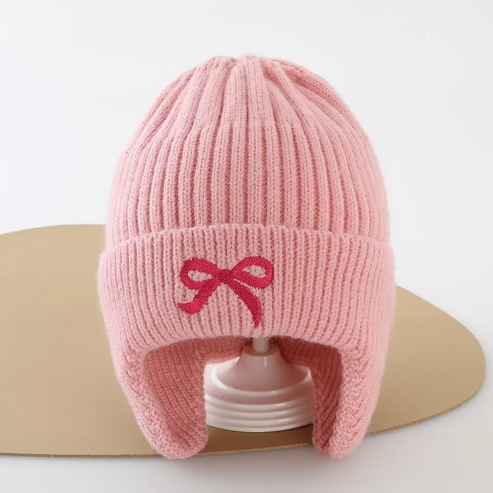 

Новый вязаный пуловер, ветрозащитная теплая шапка для защиты ушей, холодостойкая вязаная шапка с бантом и вышивкой для спорта на открытом воздухе