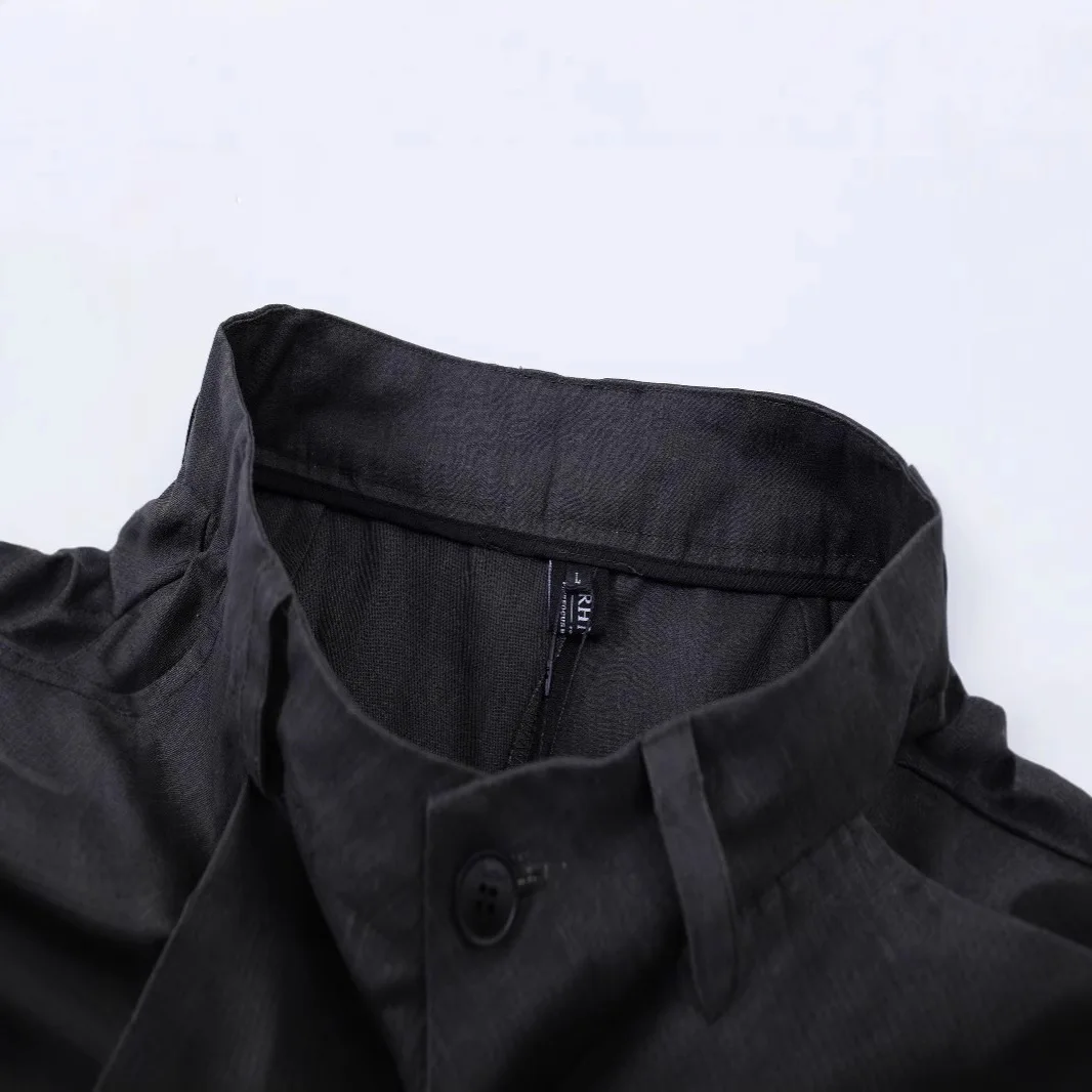 Pantaloni corti neri a gamba larga con design a flangia finta in stile americano estivo Pantaloncini casual a pieghe larghe neutre