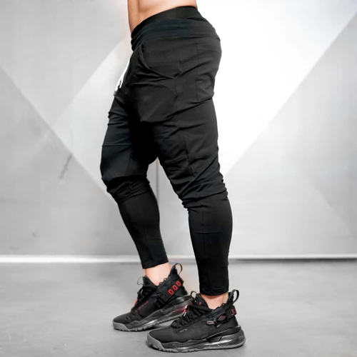 Imagen 2 del producto Pantalones de chándal de gimnasio para hombre, ropa deportiva informal, de algodón, para Fitness, primavera y otoño