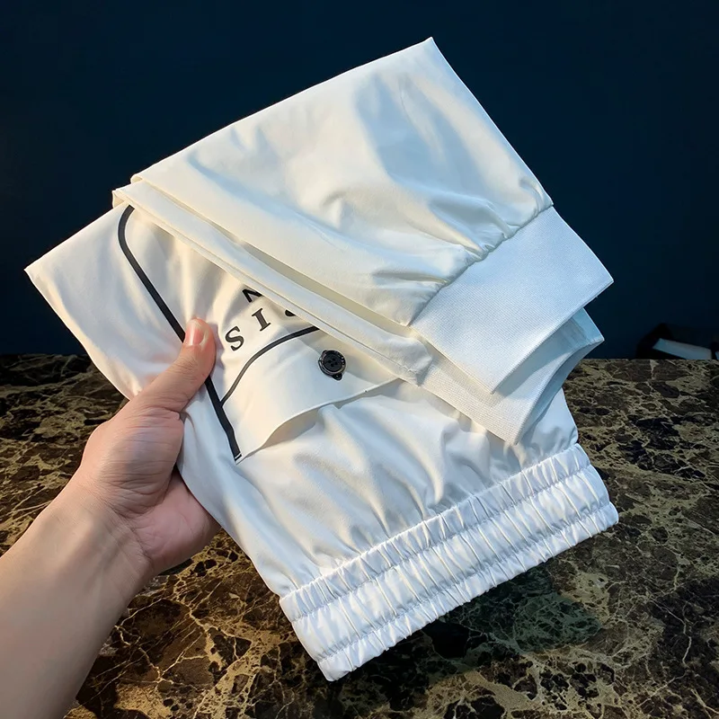 Pantalones deportivos informales ultrafinos de verano para hombre, pantalones ajustados de secado rápido, elásticos, ligeros y a la moda