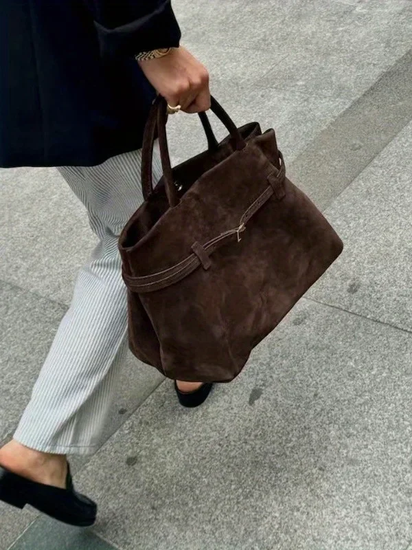 

2025 autumn and winter new matte suede belt lazy wind commuter women's bag Public design buckle portable tote bag