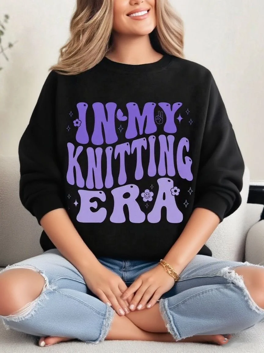 Zwart los sweatshirt met ronde hals en leuke "IN MY KNITTING ERA" letterprint
