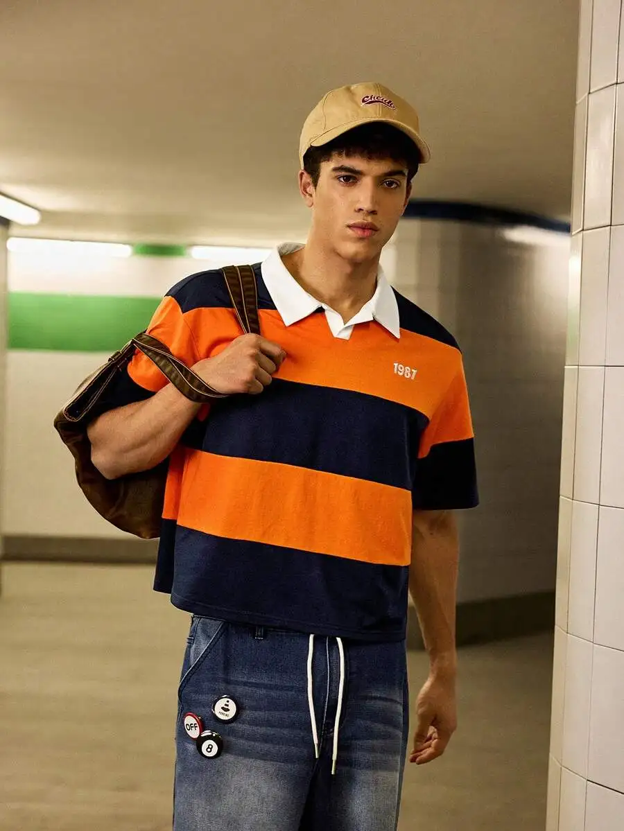 

Men's Knitted Striped Casual Loose Short Sleeve Polo Shirt with Embroidered Year Detail