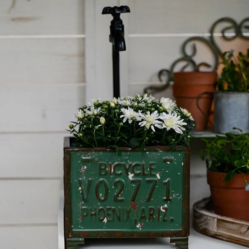 

Vintage Iron Faucet with Flower Pots and Unique Design for Garden and Patio Decoration