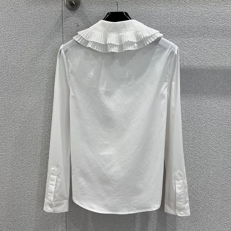 Hoogwaardig gelaagd geplooid damesshirt met poppenkraag en lange mouwen met Franse elegantie en luxe 25102289