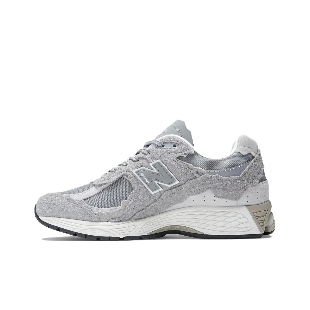 

New Balance NB 2002R lacing shock absorber mid-cut casual running shoes for men and women, gray.