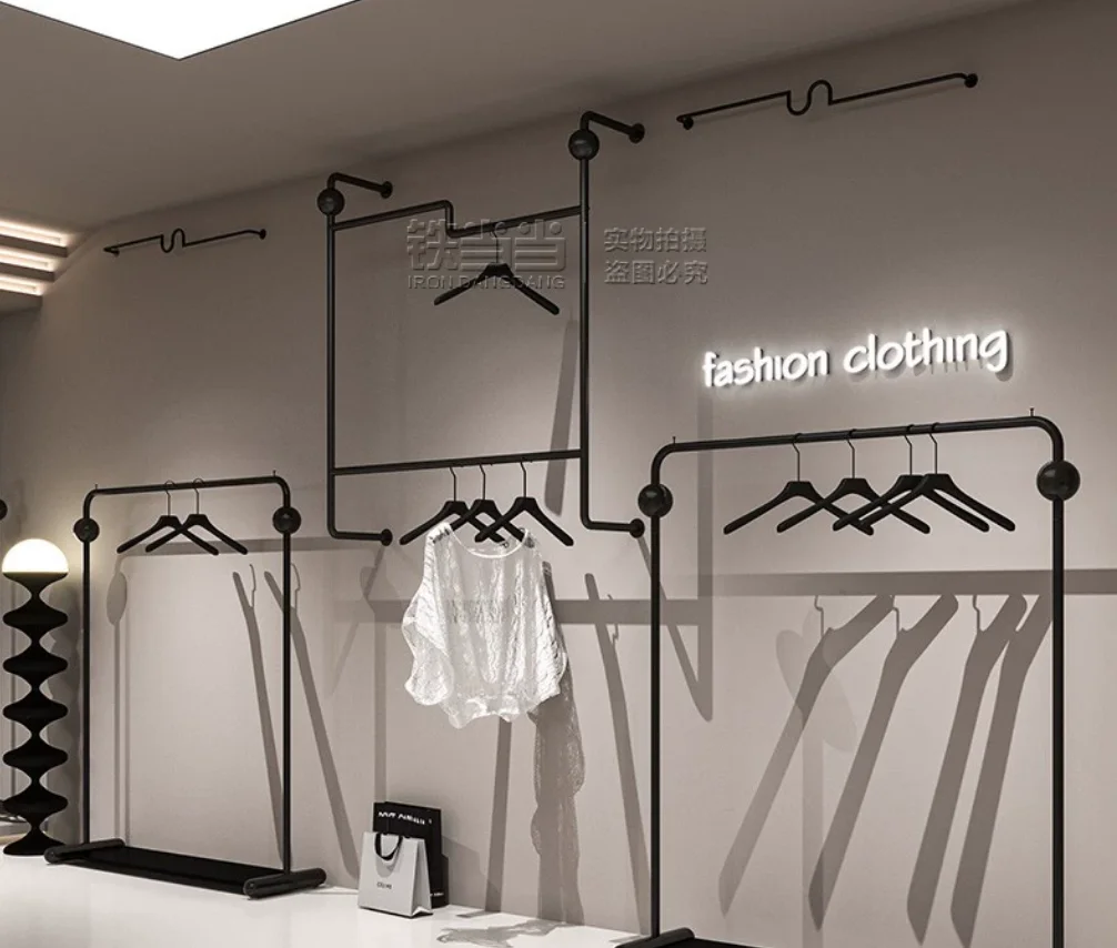 

Clothing store shelves, wrought iron black floor hanging hangers, women's clothing store wall mounted clothing display racks