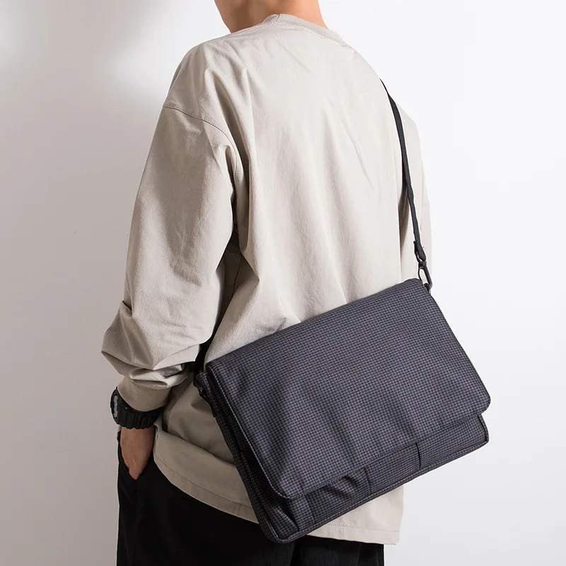 Waterproof Oxford shoulder bag flip large capacity 12 inch computer storage Hugh light and simple student work bag