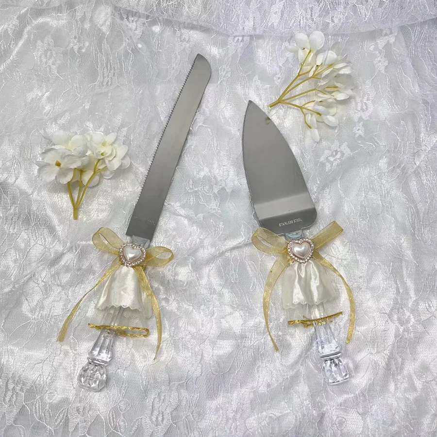 

A box of wedding cutlery. Match with a gold bow and love wedding gift. Perfect for cake cutting, wedding season and engagement,